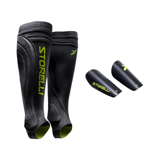 Black shin guards with green accents and 'Storelli' branding on a white background